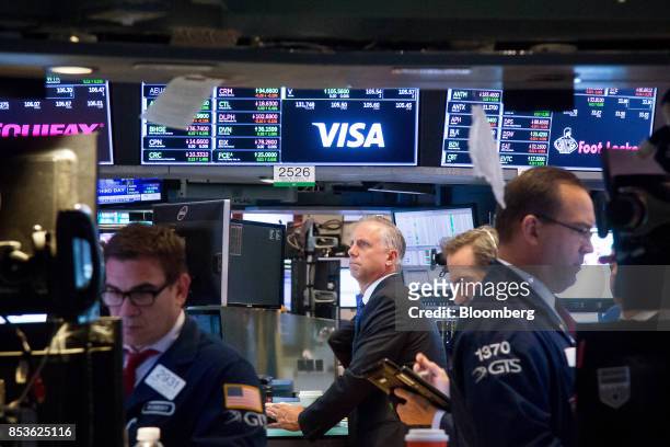 Traders work on the floor of the New York Stock Exchange in New York, U.S., on Monday, Sept. 25, 2017. U.S. Stocks tanked and bonds gained as North...
