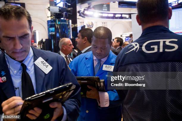 Traders work on the floor of the New York Stock Exchange in New York, U.S., on Monday, Sept. 25, 2017. U.S. Stocks tanked and bonds gained as North...