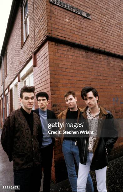 Photo of Andy ROURKE and Johnny MARR and Mike JOYCE and MORRISSEY and The Smiths; L-R: Morrissey, Mike Joyce, Andy Rourke, Johnny Marr - posed, group...