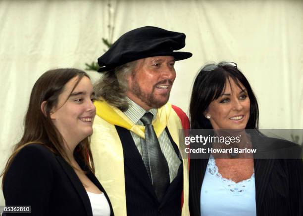 Photo of BEE GEES; Accepting honorary music doctorates @ Manchester University