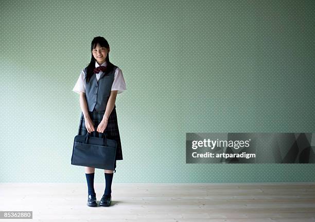 teenagegirl smiling with wearing school uniform - ragazza scuola foto e immagini stock