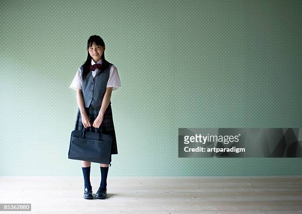teenagegirl smiling with wearing school uniform - 制服 ストックフォトと画像