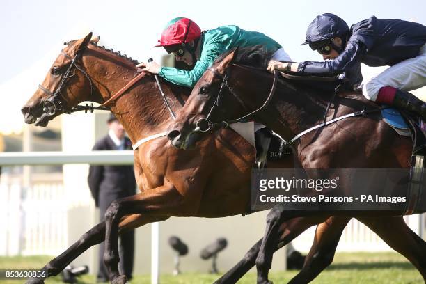 Hartnell ridden by Joe Fanning wins the Queen's Vase ahead of close second Century ridden by Joseph O'Brien during Day Four of the 2014 Royal Ascot...