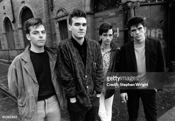 Photo of The Smiths and MORRISSEY and Mike JOYCE and Johnny MARR and Andy ROURKE; L-R: Andy Rourke, Morrissey, Johnny Marr, Mike Joyce - posed, group...