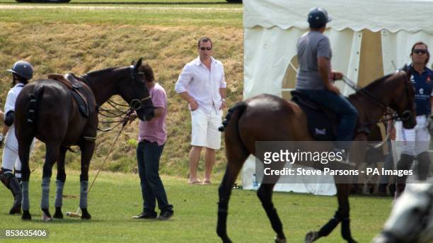 Peter Phillips watches the Goldin Group Charity Polo during the Gloucestershire Festival of Polo at the Beaufort Polo Club near Tetbury,...