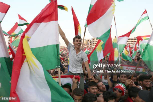 Supporters wave Kurdish flags during a rally for the upcoming referendum for independence of Kurdistan on September 22, 2017 in Erbil, Iraq. The...