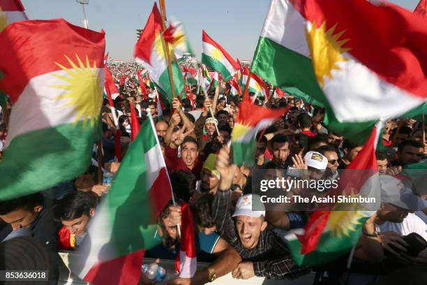 Supporters wave Kurdish flags during a rally for the upcoming referendum for independence of Kurdistan on September 22, 2017 in Erbil, Iraq. The...