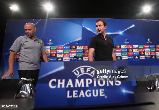 Head coach Peter Bosz and Mario Goetze arrive for a Borussia Dortmund press conference ahead of their UEFA Champions League Group H match against...