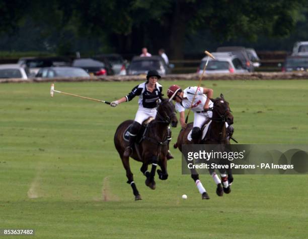 Silver Town Properties's Olivia Hutchinson takes on Langley Polo Academy's Tom Townsend in the Langley School Polo Academy Challenge Cup during the...