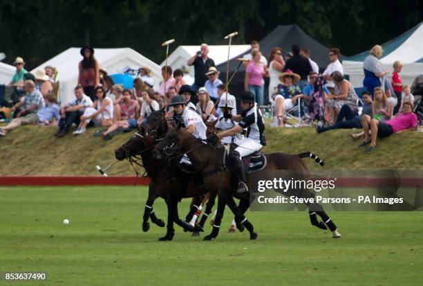 Silver Town Properties take on Langley Polo Academy in the Langley School Polo Academy Challenge Cup during the Gloucestershire Festival of Polo at...