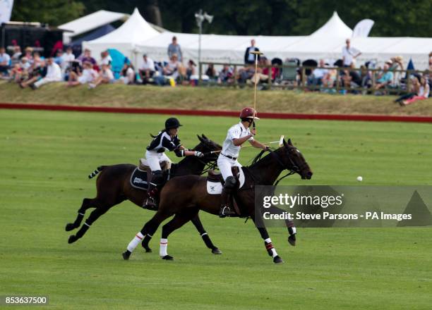 Silver Town Properties's Olivia Hutchinson takes on Langley Polo Academy's Tom Townsend in the Langley School Polo Academy Challenge Cup during the...