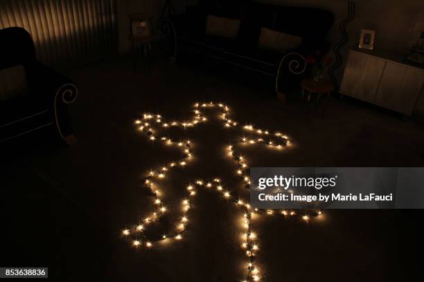 fun with christmas lights in the dark - body of proof stock pictures, royalty-free photos & images