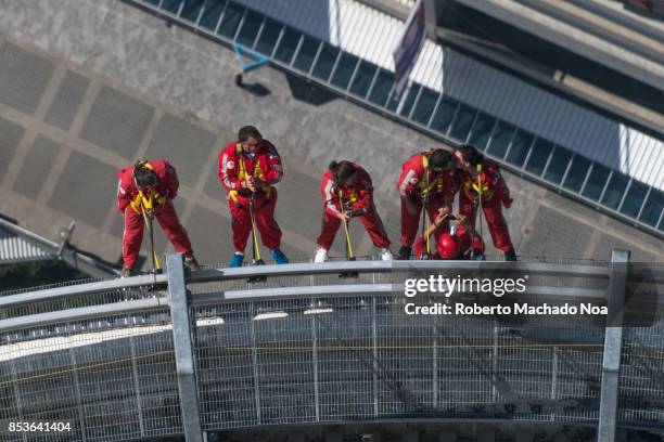 Couple kisses while doing the EdgeWalk in the CN Tower. It is the world's highest full-circle, hands-free walk. The attraction is closed in Winter...