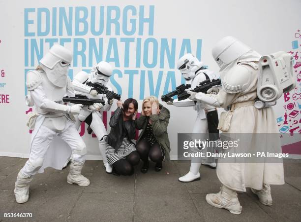 Star Wars characters Stormtroopers and Snowtroopers with fans ahead of a screening of Star Wars Episode V The Empire Strikes Back at the Edinburgh...