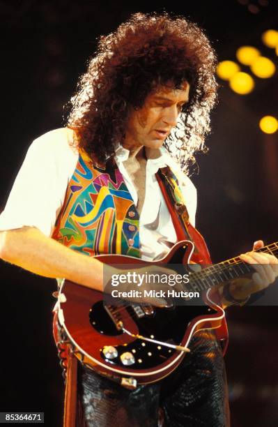 Photo of Brian MAY and QUEEN, Brian May performing on stage at the Freddie Mercury Tribute concert