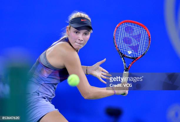 Donna Vekic of Croatia returns a shot during the first round match against Zhang Shuai of China on Day 2 of 2017 Dongfeng Motor Wuhan Open at Optics...