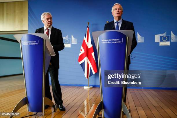 Michel Barnier, chief negotiator for the European Union , right, speaks as David Davis, U.K. Exiting the European Union secretary, listens during a...
