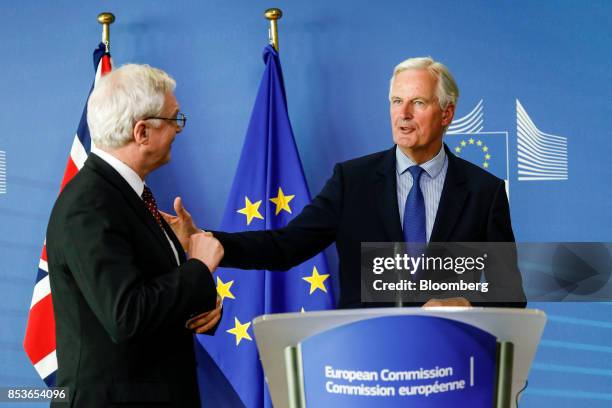 David Davis, U.K. Exiting the European Union secretary, left, and Michel Barnier, chief negotiator for the European Union , leave after speaking...
