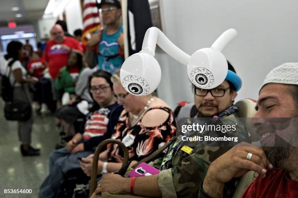 Balloon artist and activist with a disability rights group ADAPT waits in line before a Senate Finance Committee hearing to consider the...