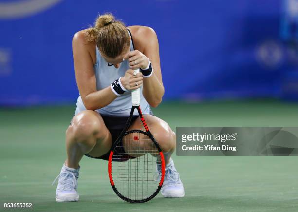 Petra Kvitova of Czech Republic reacts following her defeat Ladies Singles match against Peng Shuai of China in round 1 during Day 2 of 2017 Wuhan...