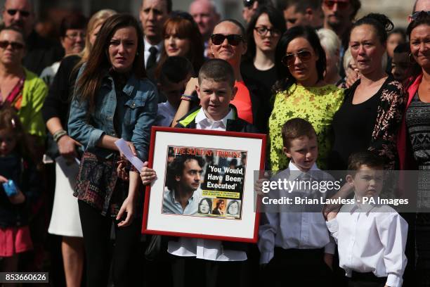 Mourners of Gerry Conlon, who was wrongly convicted of the 1974 IRA Guildford pub bombing, arraive at St Peter's Cathedral, Belfast, for his funeral.