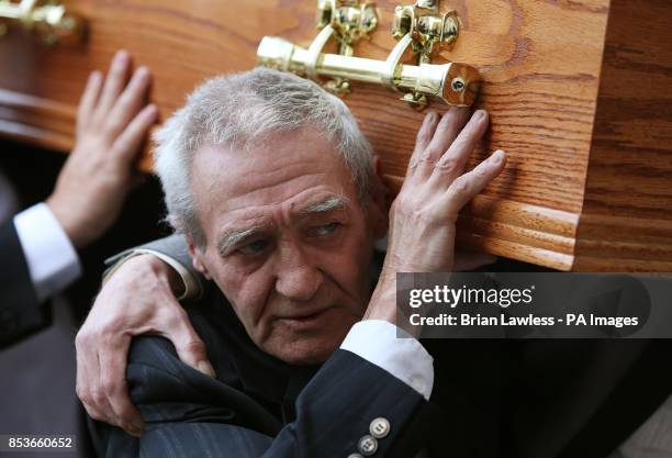 Birmingham Six member Paddy Hill carries the coffin of Gerry Conlon, who was wrongly convicted of the 1974 IRA Guildford pub bombing, to St Peter's...