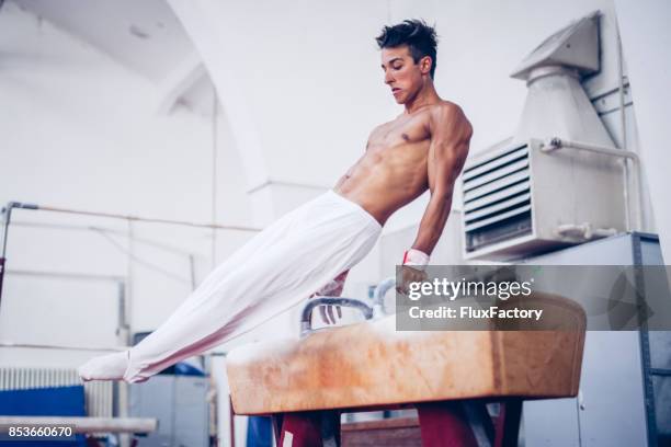 preparing for gold - male gymnast stock pictures, royalty-free photos & images