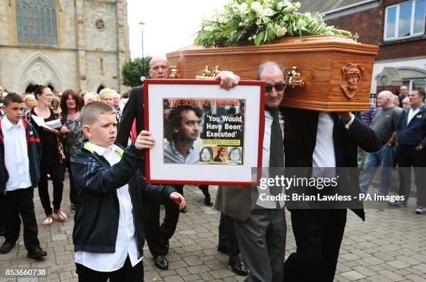 The coffin of Gerry Conlon, who was wrongly convicted of the 1974 IRA Guildford pub bombing, as it carried from St Peter's Cathedral, Belfast, during...