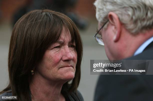 Ann McKernan and Tanaiste Eamon Gilmore attend the funeral of Gerry Conlon, who was wrongly convicted of the 1974 IRA Guildford pub bombing, at St...