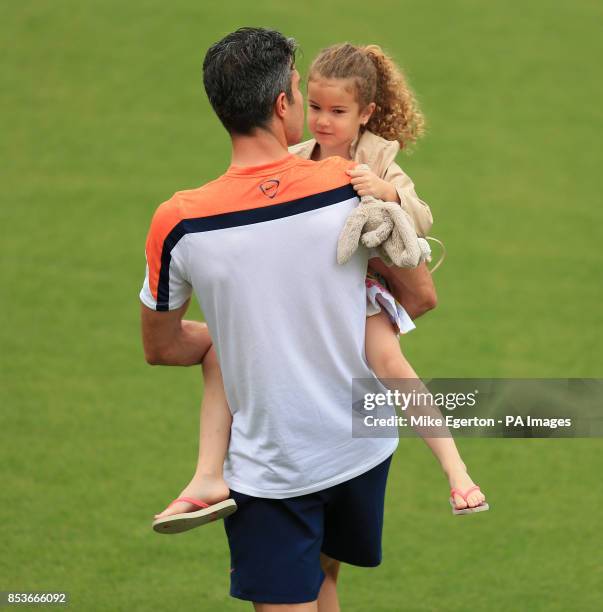 Robin van Persie with his daughter Dina during the training session at Estadio Jose Bastos Padilha, Rio de Janeiro, Brazil.