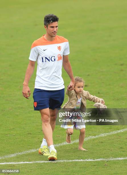 Robin van Persie with his daughter Dina during the training session at Estadio Jose Bastos Padilha, Rio de Janeiro, Brazil.