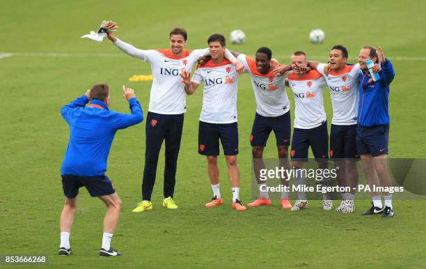 Manager Louis van gaal pretends to take a photograph of the winning team during the training session at Estadio Jose Bastos Padilha, Rio de Janeiro,...