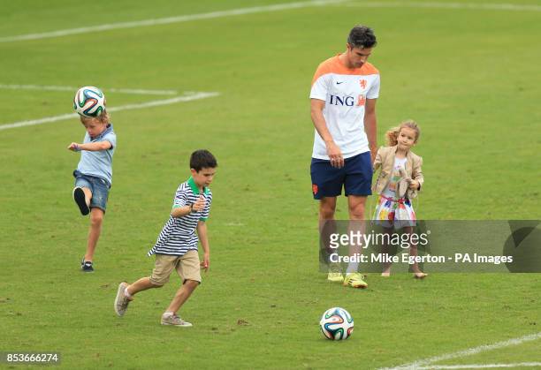 Robin van Persie with his son named Shaquee l and daughter Dina during the training session at Estadio Jose Bastos Padilha, Rio de Janeiro, Brazil.