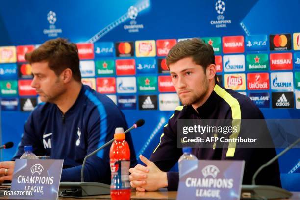 Tottenham's head coach Mauricio Pochettino and player Ben Davies attend a press conference at the GSP Stadium in Nicosia, on the eve of the UEFA...