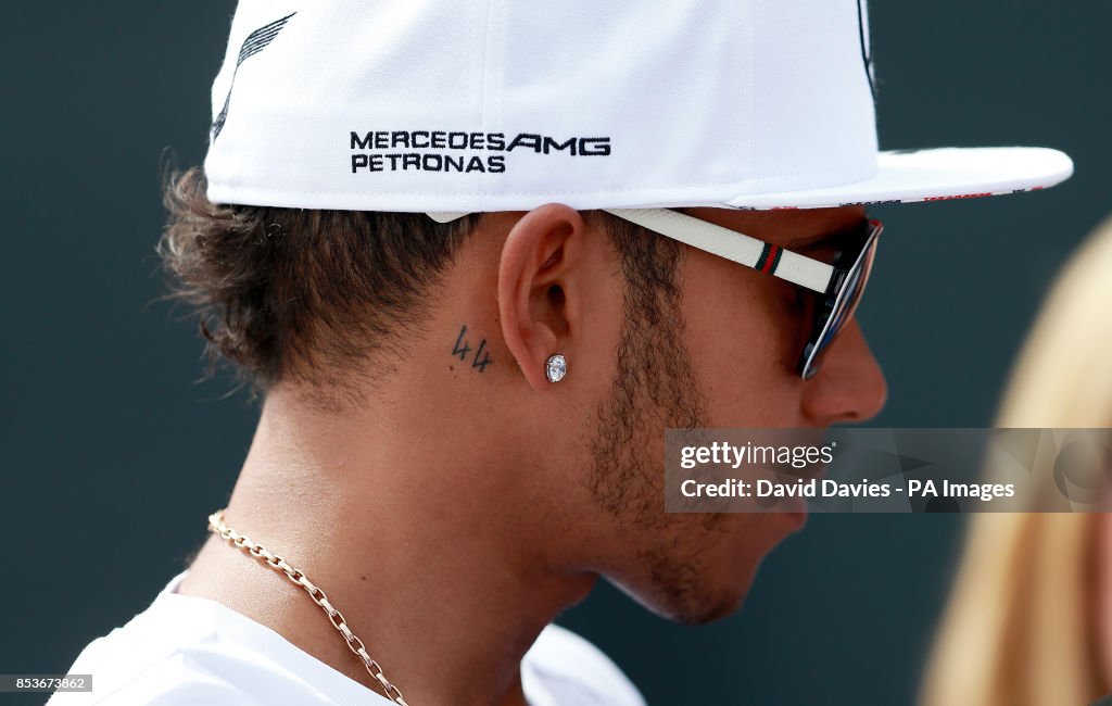 Mercedes Lewis Hamilton with is '44' tattoo seen behind his ear... News  Photo - Getty Images