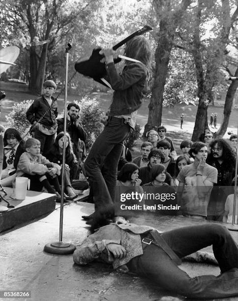 The rock group MC5 perform live at West Park in 1969 in Ann Arbor, Michigan. Manager John Sinclair can be seen in the audience on the right.