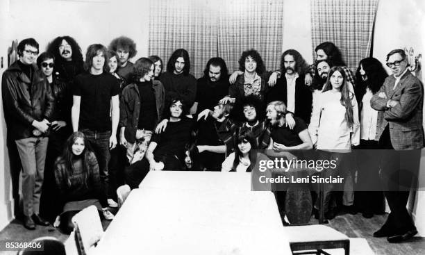 October 1968: Rock groups MC5 and The Stooges pose for a photo with friends and record executives as they both sign contracts with Electra Records in...