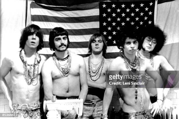 The rock group MC5 pose for a photo in front of an American flag in 1967 in Detroit, Michigan.