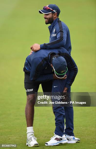 India's Varun Aaron and Ravindra Jadeja during a nets session at Trent Bridge, Nottingham.