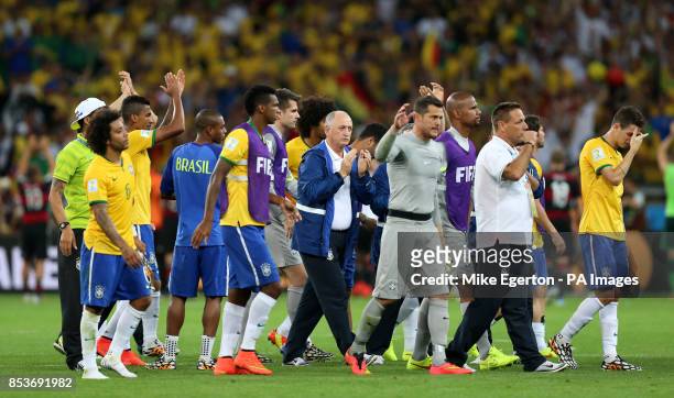 Brazil players and staff walk over to applaud the fans after the final whistle during the FIFA World Cup Semi Final at Estadio Mineirao, Belo...