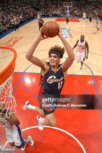 Anderson Varejao of the Cleveland Cavaliers goes up for a dunk against Baron Davis of the Los Angeles Clippers at Staples Center on March 10, 2009 in...