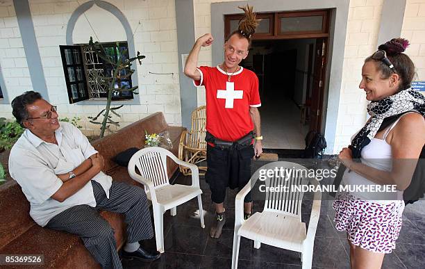 Lifestyle-India-tourism-health-addiction,FEATURE by Phil Hazlewood Rehabilitated Russian drug-addict Andrey is watched by his friend Shannon and...