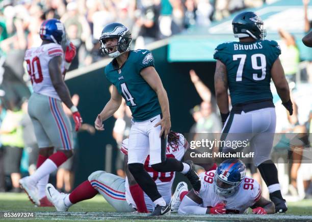 Jake Elliott of the Philadelphia Eagles celebrates in front of Damon Harrison, Robert Thomas, and Jason Pierre-Paul of the New York Giants after...