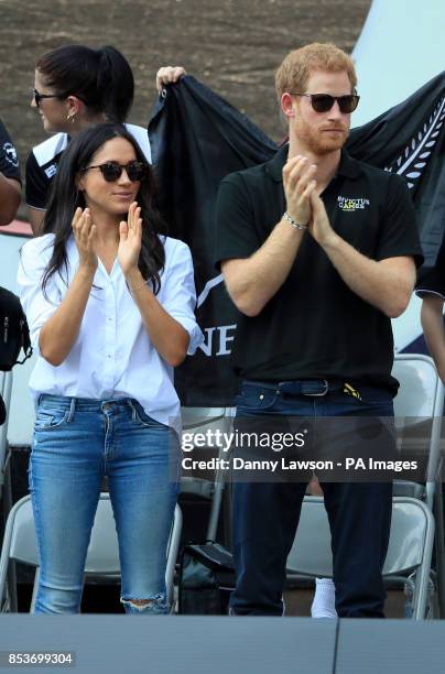 Prince Harry and Meghan Markle applaud as they watch Wheelchair Tennis at the 2017 Invictus Games in Toronto, Canada.