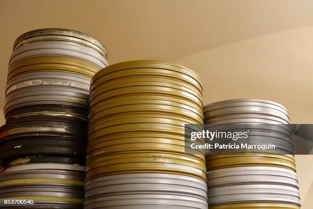 film canisters on a shelf - golden reel stock pictures, royalty-free photos & images