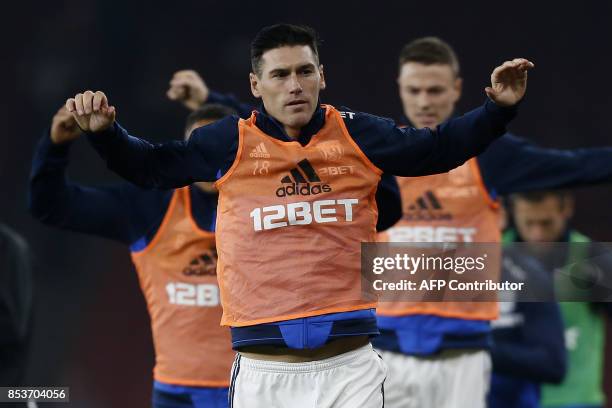 West Bromwich Albion's English midfielder Gareth Barry warms up ahead of the English Premier League football match between Arsenal and West Bromwich...