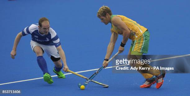 South Africa's Tim Drummond is challenged by Scotland's Gordon McIntyre during the Investec London Cup game at the Lee Valley Hockey and Tennis...