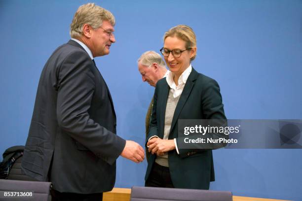 Top candidates of Alternative for Germany Alexander Gauland and Alice Weidel and chaiman Joerg Meuthen leave a press conference on the day after the...