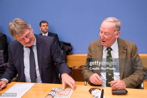 Top candidate of Alternative for Germany Alexander Gauland and chaiman Joerg Meuthen look at a Bild newspaper at the beginning of a press conference...