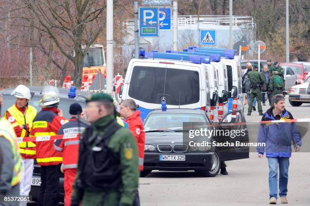 Policemen and ambulance are seen at the crime scene at the Albertville-School Centre on March 11, 2009 in Winnenden near Stuttgart, Germany....